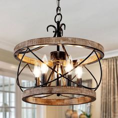 a chandelier hanging from the ceiling in a living room