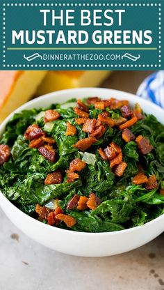 a white bowl filled with spinach and bacon