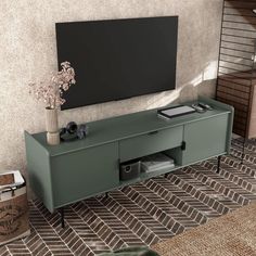 a tv stand with a plant on top of it