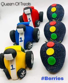 three toy cars made out of rocks with the words queen of treats written on them