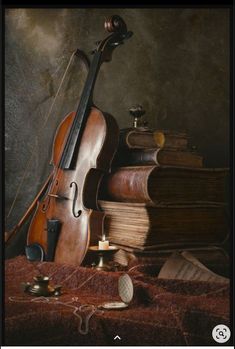 a violin and some books on a table