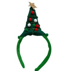 Deck yourself out in festive fun with our delightful Christmas Tree Headband! This charming accessory features a mini Christmas tree complete with fluffy pom-pom ornaments, sparkling tinsel garlands, and topped with a glittery gold star. Soft and comfortable, the green plush headband ensures a snug fit, making it a perfect festive addition for holiday parties, events, or just spreading seasonal cheer. Designed to be one-size-fits-most, this headband is great for both adults and children, allowin Tree Headband, Christmas Tree Headband, Plush Headband, Holiday Headbands, Tinsel Garland, Fun World, School Event, Mini Christmas Tree, Mini Christmas