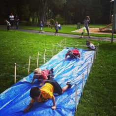 children are playing on an inflatable trampoline