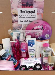 a cardboard box filled with lots of beauty and personal care items, including hand sanitizers