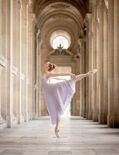 a woman in white dress standing on one leg