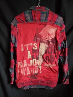 Upcycled Flannel Shirt Red and green plaid Lightly bleached/ splattered See pictures A Christmas Story One of a kind Robert Stock Unisex size L Pet Friendly Home Red Graphic Print Shirt For Fall, Red Flannel Long Sleeve Top, Fall Red Graphic Print Shirt, Plaid Cotton Top For Winter, Winter Cotton Plaid Tops, Winter Plaid Cotton Tops, Red Winter Shirt For Streetwear, Vintage Red Flannel Shirt, Vintage Long Sleeve Graphic Print Flannel Shirt