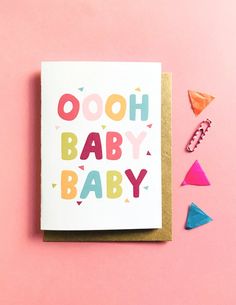 a card that says oooh baby baby on it next to confetti