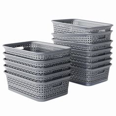 four grey plastic baskets stacked on top of each other with holes in the bottom and sides