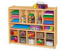 a wooden shelf filled with lots of books and crafting supplies on top of it