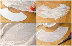 four pictures showing how to make an origami bird with white paper and glue