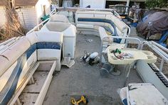 the inside of a boat that is being used as a storage area for other boats