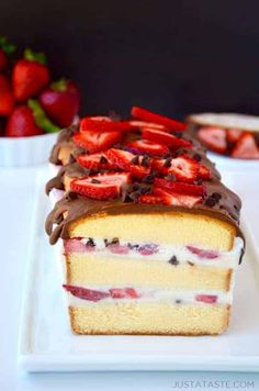 a piece of cake with chocolate and strawberries on top