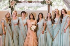 a group of women standing next to each other