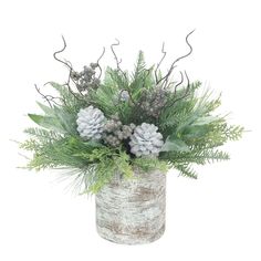 a vase filled with pine cones and greenery