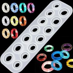 an assortment of different colored rings on a black background with space for the ring to be placed