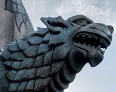 a statue of a dragon on top of a building