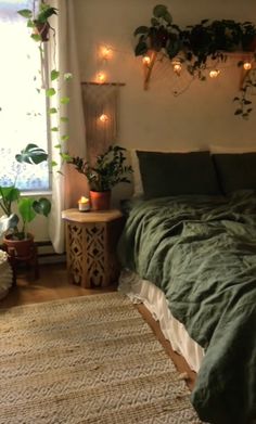 a bed sitting in a bedroom next to a window with plants on the wall above it