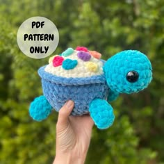 a crocheted stuffed animal with a cupcake on it's back and the words pop pattern only above it