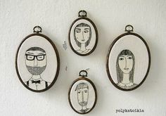 four oval pendants with pictures of people on them