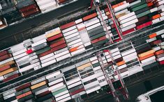 an aerial view of shipping containers at the port