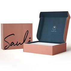 an open box with the word sale written in black ink on it, next to another box