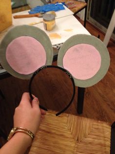 someone is making mickey mouse ears out of felt