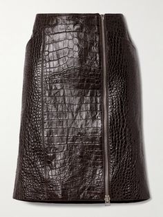 TOM FORD incorporates luxurious croc-effect leather into so many of its Spring '24 designs, including this skirt. It has a silk lining for a smooth, comfortable fit and a silver-tone zipper that traces from the high-rise waist to the knee-grazing hem - adjust it to reveal a flash of leg as you walk. High Waisted Leather Skirt, Porter Bag, Tom Ford Leather, Brown Leather Skirt, Tom Ford Clothing, Latest Skirts, Leather Midi Skirt, Croc Leather, Leather Mini Skirt