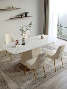 a dining room table with chairs around it