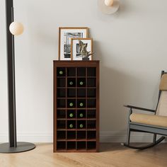 a room with a rocking chair and a book shelf filled with green balls in it