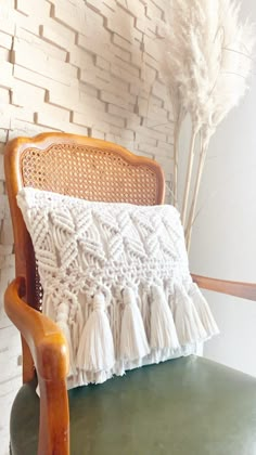 a chair with a white pillow on top of it