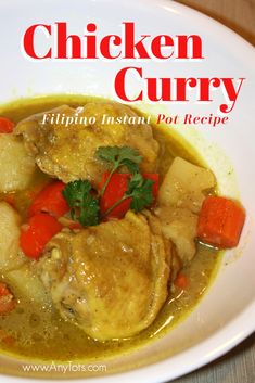 chicken curry in a white bowl with carrots and celery on the side