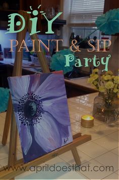 a painting and sip party with flowers on the table