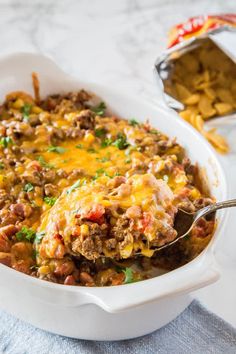 a casserole dish filled with ground beef and cheese