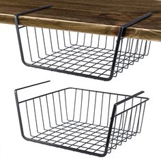 two metal baskets on top of a wooden table with wire hanging from the bottom and sides