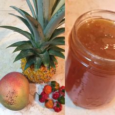 there is a jar of liquid next to a pineapple