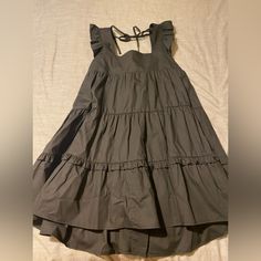 Black, Size Small, Never Worn, Still Has Tags Black Ruffled Sundress For Spring, Black Mini Sundress With Ruffles, Black Ruffled Mini Sundress, Black Sundress With Ruffles, Black Ruffled Sundress, Black Sleeveless Sundress For Date Night, Black Cotton Dress For A Day Out, Black Mini Sundress For Spring, Black Cotton Vacation Dress