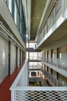 the inside of a building with multiple floors and balconies on either side of it