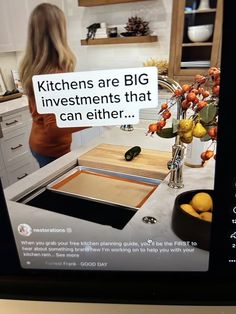 a woman standing in front of a kitchen sink next to a counter top with fruit on it