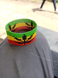 a person wearing a bracelet made out of beads