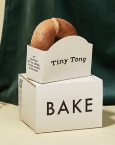 there are two boxes that have different types of bread on top of each other,