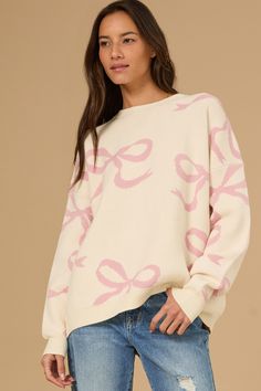 This long-sleeve, oversized sweater features a playful bow pattern. It's the ideal blend of comfy and cute. Birthday Fit, Bow Sweater, Elegant Sweater, Bow Print, Preppy Room, Pink Bows, Bow Pattern, Casual Wedding Dress, Maxi Dress Cocktail