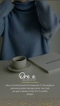 a woman sitting at a table in front of a laptop computer and cup of coffee