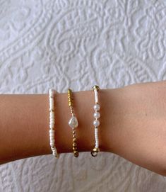 This gorgeous gold bracelet stack is a perfect neutral bracelet set and has a beautiful mix of golds and whites. It is homemade and great quality! Beaded Bracelets Neutral, Neutral Bracelet, Gold Bracelet Stack, Neutral Bracelets, Gold Bracelets Stacked, Homemade Bracelets, Gold Armband, White Bracelets, Birthday Diy