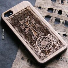 an intricately carved wooden case for the iphone