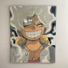 a painting of a smiling woman with blonde hair and blue eyes is hanging on the wall