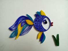 a blue and yellow fish made out of plastic