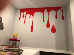 the paint is dripping down on the wall