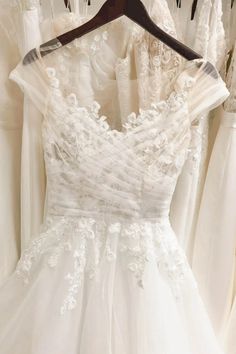 wedding gowns are on display in the bridal room