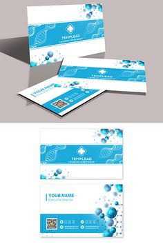 two business cards with blue bubbles on the front and back, one is folded in white paper