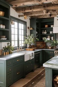 a kitchen with green cabinets and white counter tops, wooden beams in the ceiling and potted plants on the windowsill